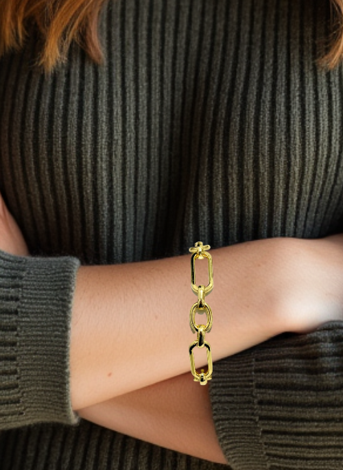 Jasmine Gold Chunky Paperclip Bracelet – a trendy yet timeless 18K gold-plated brass chain bracelet with a 12mm width and a toggle clasp. Available in three lengths: Small (7.5”), Medium (8.0”), and Large (9”). Handmade in Texas and donated by Christy Jean.