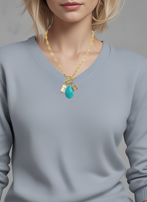 2-Way Gemstone Necklace – a versatile gold-plated paperclip chain necklace featuring genuine magnesite. Can be worn in two lengths: short at 17.5” or long at 35”. Handmade in Texas by Christy Jeannie Jewelry, offering a striking and distinctive look for any outfit."

This description is optimized for search engines while accurately highlighting key product details. Let me know if you need any refinements!